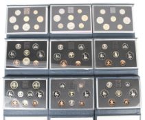 Nine proof sets of coins.