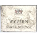 A large painted cast aluminum polychromed sign for 'WYVERN LOWER SCHOOL' with coat of arms.
