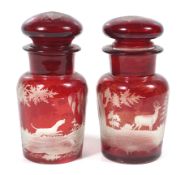 A pair of 19th century Bohemian Glass ruby red cameo cut pickle jars.