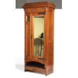 A 19th century Arts and Crafts inlaid oak wardrobe. Probably Shapland & Petter for Liberty.