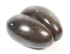 A circa 1900 large Coco de Mer seed nut formed as a twin hinged box.