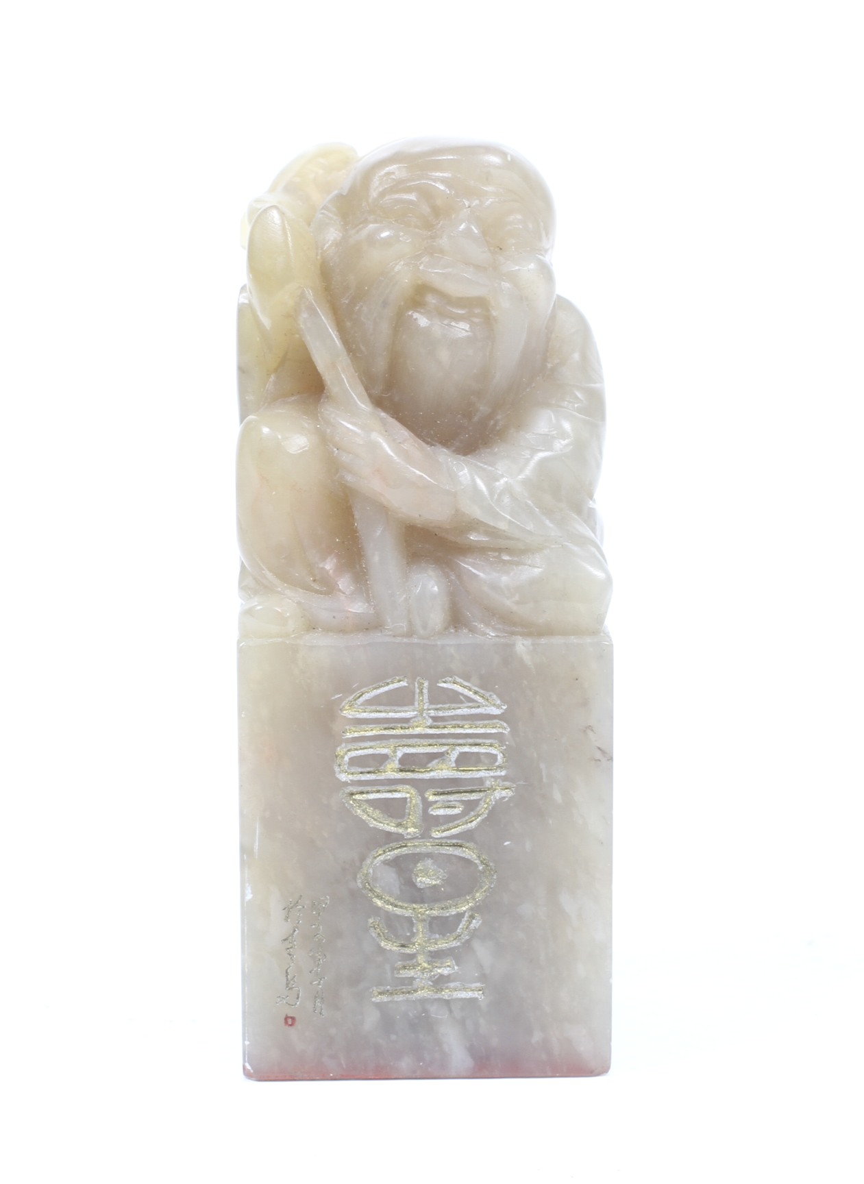 A Chinese soapstone seal carved with a crouching figure holding a branch.