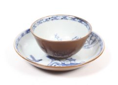 An 18th century cafe au lait, blue and white tea bowl and saucer.