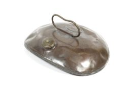 A brass and copper travel warmer (some have suggested a belly warmer).