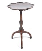 An Edwardian inlaid mahogany supper/wine tripod table, with an urn style turned column.