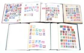 A world collection of stamps in five albums.