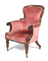 A Victorian mahogany library armchair.