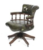A Victorian style green leather(?) button back swivel captain's/desk chair.