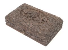 A Folk Art style, deeply carved rectangular wood box depicting a hunting scene.