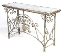 A contemporary silvered console/radiator table table decorated with urn and flowers.