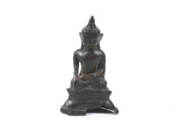 A Bumese Shan bronze figure of Shakyamuni.