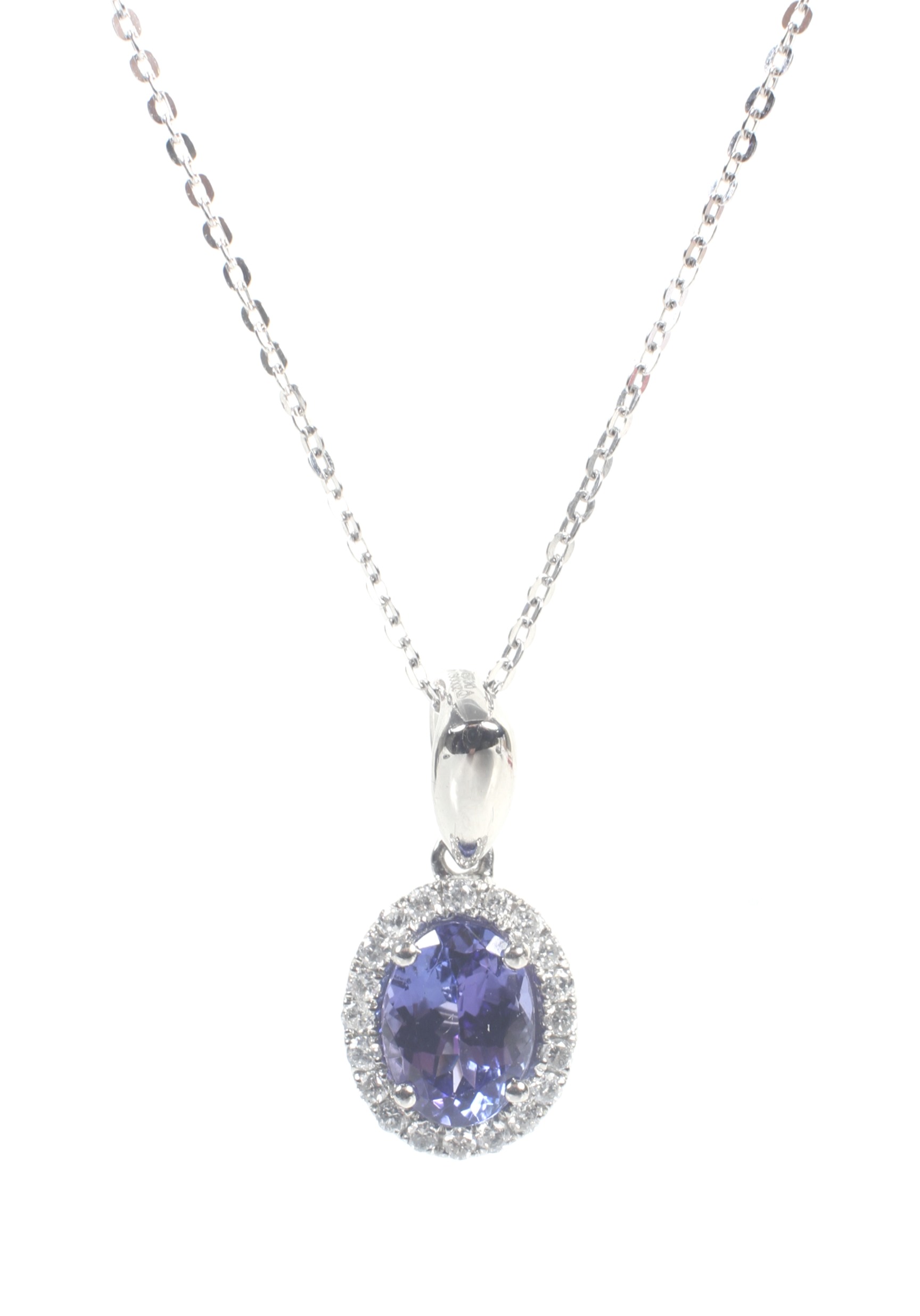 A modern platinum, tanzanite and diamond oval cluster pendant and chain. - Image 3 of 5