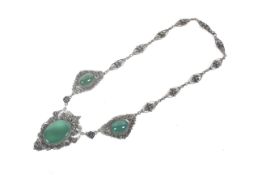 An early 20th century chrysoprase three stone necklace.
