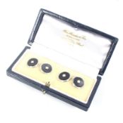 A pair of vintage 9ct white gold, black-onyx and seed pearl round twin panel cufflinks.