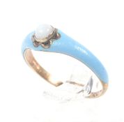 A mid-Victorian rose gold, opal and pale-blue enamel single stone ring.