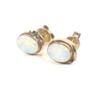 A pair of mid 20th century gold and opal stud earrings.
