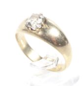An early 20th century gold and diamond solitaire ring. The cushion-shaped old-cut stone approx. 0.