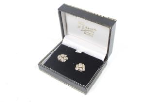 A pair of vintage diamond floral cluster stud earrings.