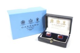 Garrard, a pair of vintage silver and enamel canted-rectangular baton-twist cufflinks.