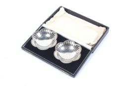 A pair of silver petal shaped pedestal sweet dishes.