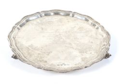 A silver shaped round salver.