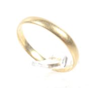 A Victorian 22ct gold D-section wedding band.