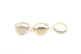 Two 9ct gold signet rings and a wedding band.