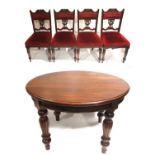 A Victorian mahogany circular extending dining table and four late 19 th century upholstered dining