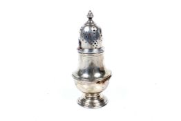 A silver vase shaped sugar caster.