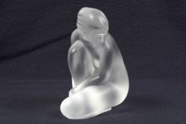 A French Lalique frosted glass figure of a kneeling/seated figure of a lady.