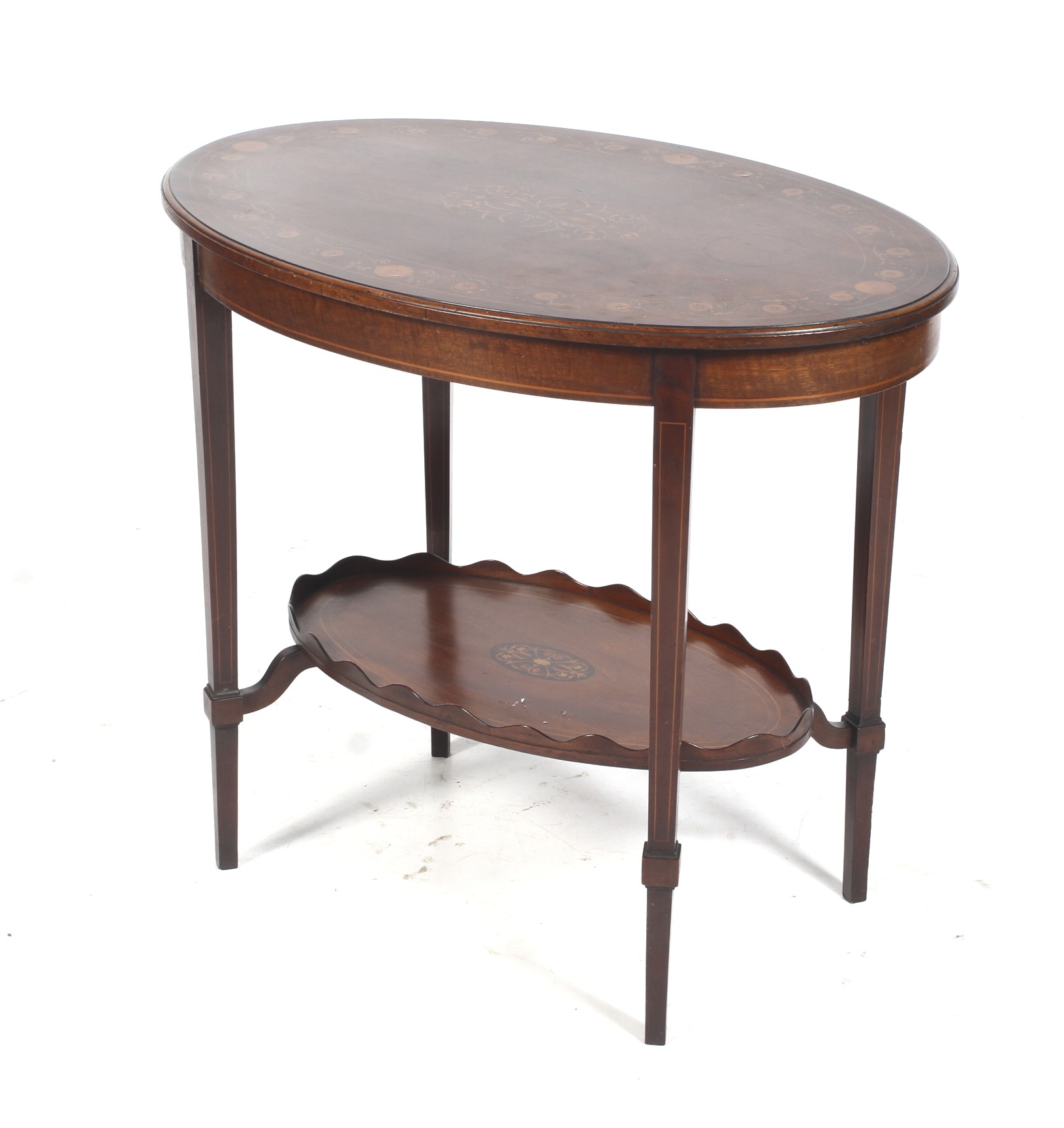A mahogany occasional table retailed by 'Heal and Son Tottenham Court Road, London'.
