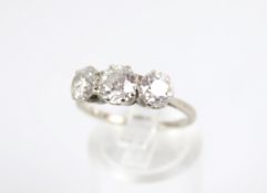 A mid-20th century diamond three stone ring. The transition cut stones approx. 0.59cts, 0.82cts & 0.