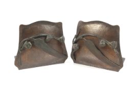 A pair of American Arts and Crafts plannished / hammered copper bookends by Fred Brosi,