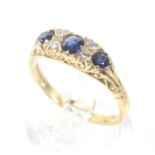 A vintage 18ct gold, sapphire and diamond cast carved half-hoop ring.
