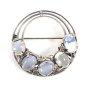 An Arts and Crafts moonstone five stone open-round brooch.