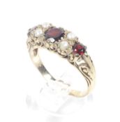 A vintage 9ct gold, garnet and half-pearl dress ring in Victorian style.