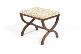 A 20 th century mahogany reeded X frame upholstered stool.