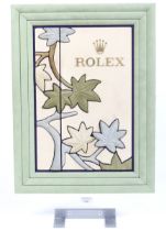 Rolex, a boutique or retailer's suede and aluminium counter top display board.