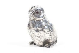 A late 19th century German silver chick shaped pepper pot.