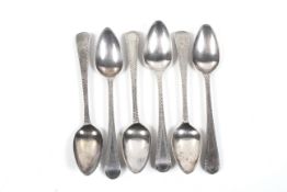 A set of six George III silver feather edge tea spoons.