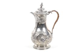 An early George III silver baluster shaped and embossed coffee pot.