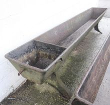 A 19th century large cast iron horse trough.