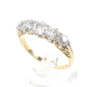 An Edwardian gold and diamond five stone ring.