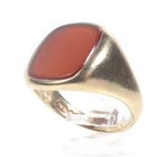 A vintage 9ct gold and carnelian oblong signet ring. The plain carnelian approx. 13.5mm x 11.