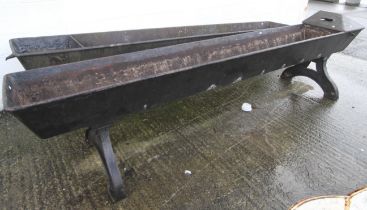 A 19th century large cast iron horse trough.