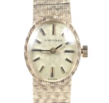 Longines, a lady's 9ct gold oval integral bracelet watch, circa 1979.