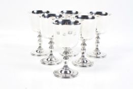 A set of six vintage silver goblets.