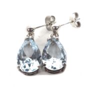 A pair of pear-shaped aquamarine pendent earrings. Each pale blue stone approx. 12.