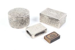 Two Indian white metal boxes and match box holder.