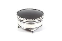 A silver and tortoiseshell mounted round trinket box.